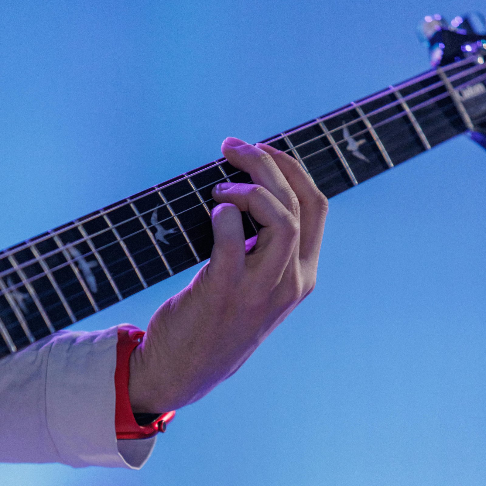 solo musician playing guitar for a live performance